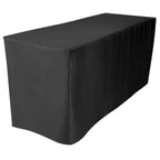 Black tablecloth on a rectangular table against a white background
